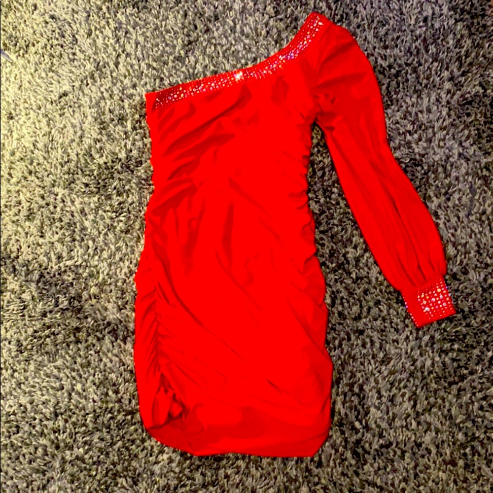 A tight red scrunch cook tail dress with gems !!